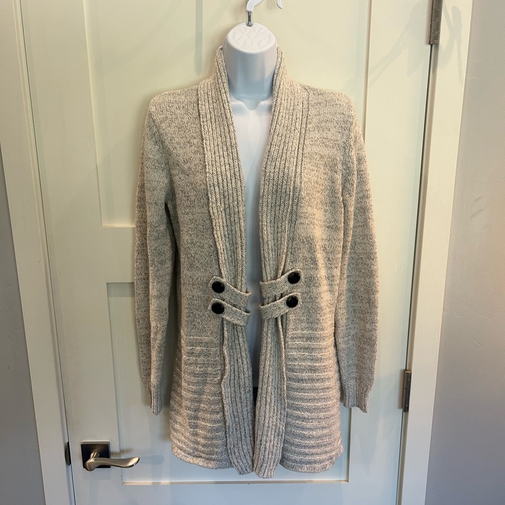 Super cute, long sweater with button details on the front